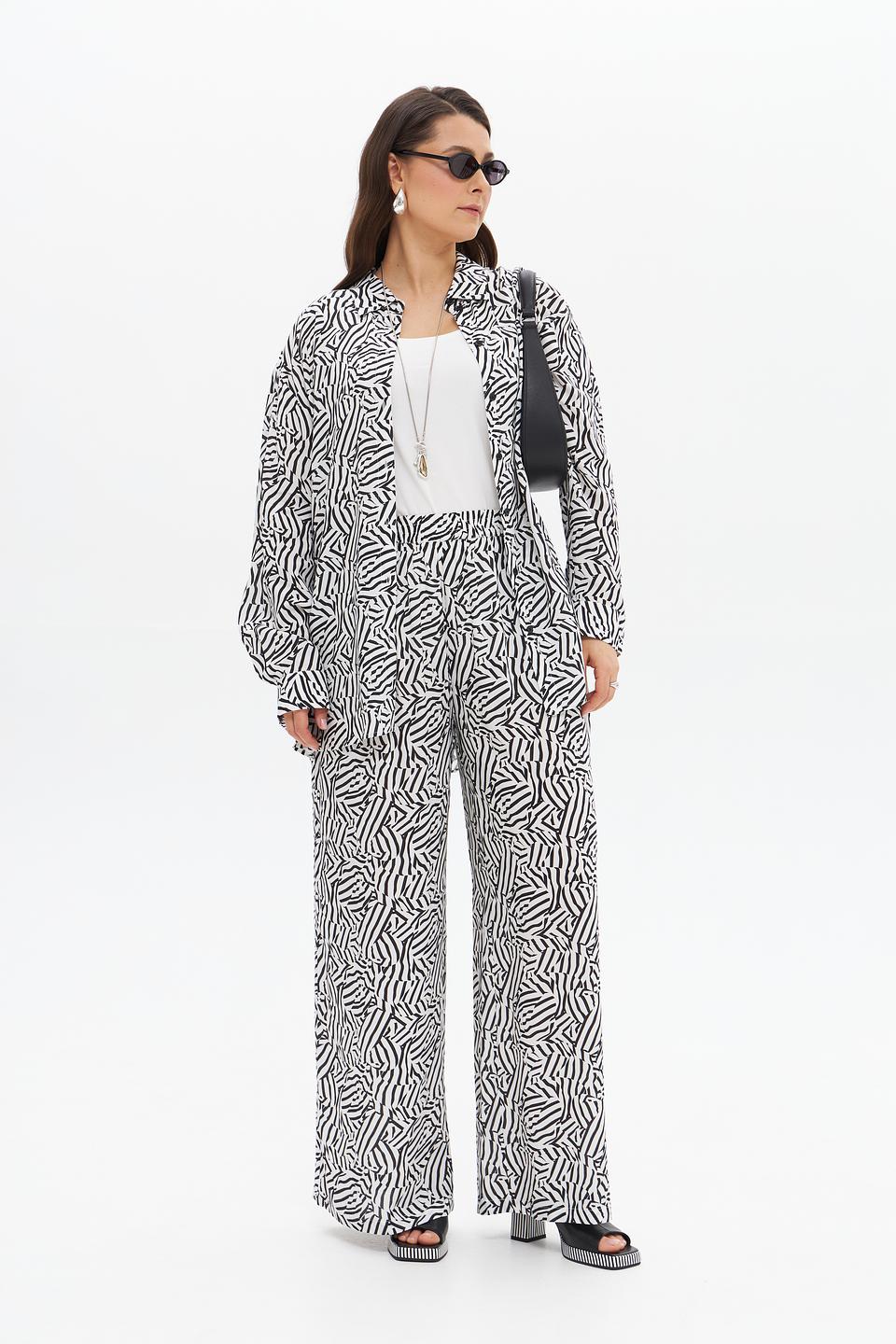 Брюки клёш UNQ принт зебра
